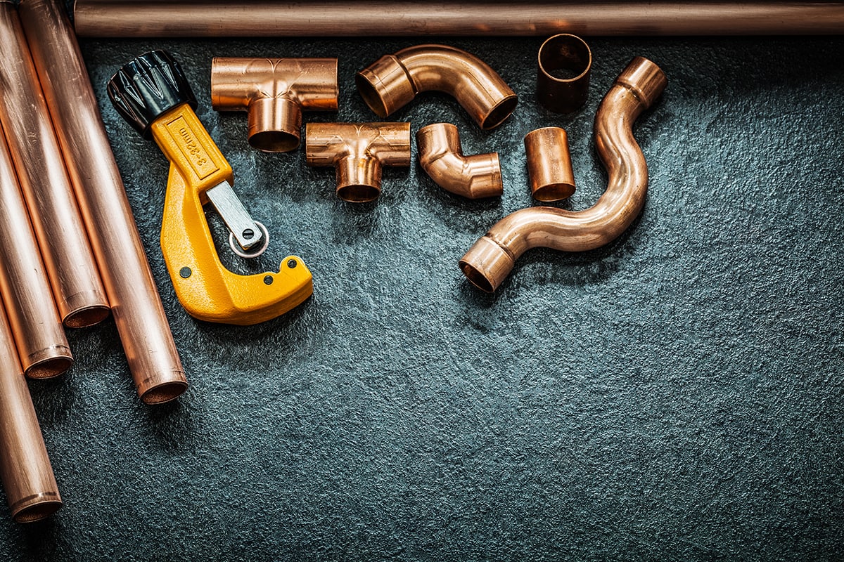 Plumbing concept copper pipes pipe cutter and fitting