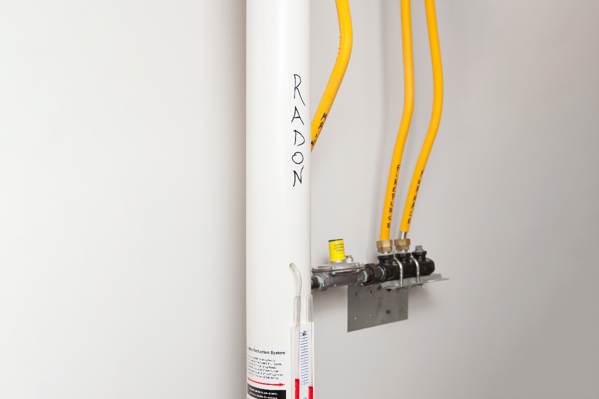 Radon vent fan pipe and monitoring system