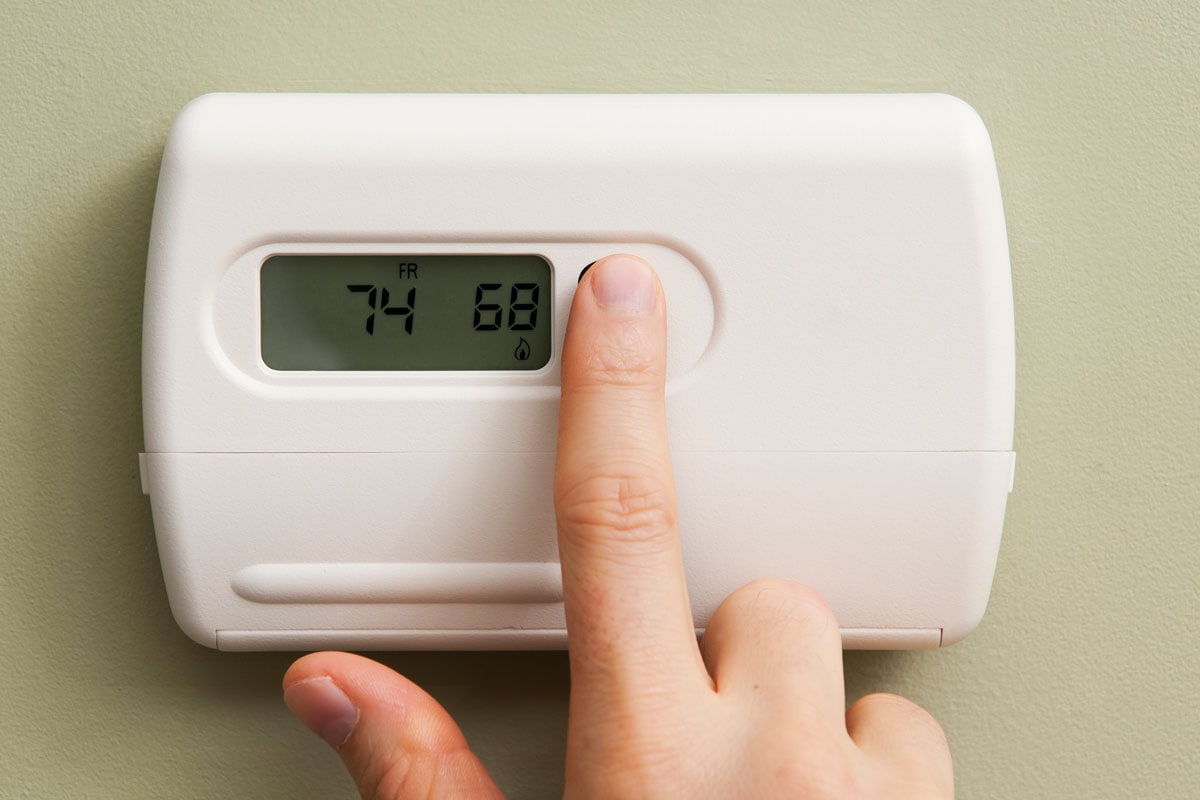 Setting the thermostat to 68 degrees for environmental and economical savings