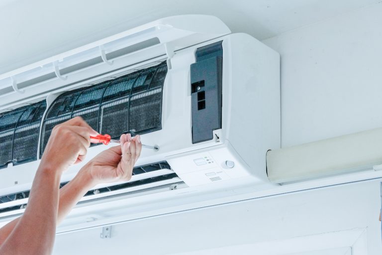 Technician repairing the air conditioner, How To Make Non Inverter AC Into Inverter AC