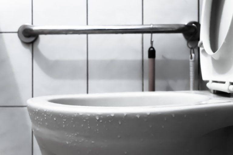 A view of a flushing white toilet, Toilet Shooting Water Out Of Bowl - Why And What To Do?