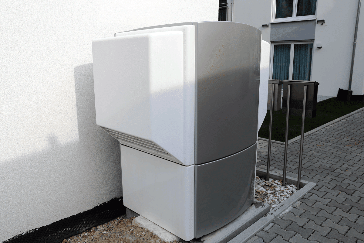 modern heat pump outside a residential home. Heat Pump Efficiency Vs. Temperature - How Do The Two Relate