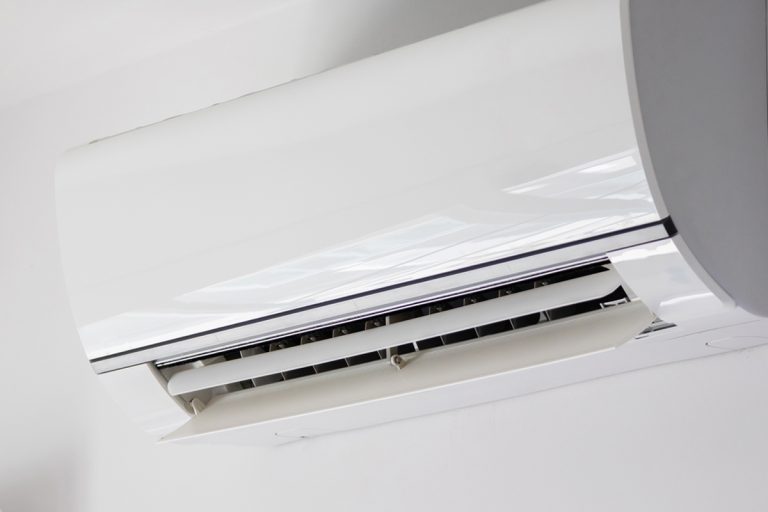 Air conditioner on white wall room interior background, AC Vs DC Air Conditioner: Which To Choose?