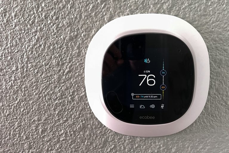 An Ecobee smart thermostat in a home.,Ecobee Thermostat Tripping Breaker [Why & What To Do]