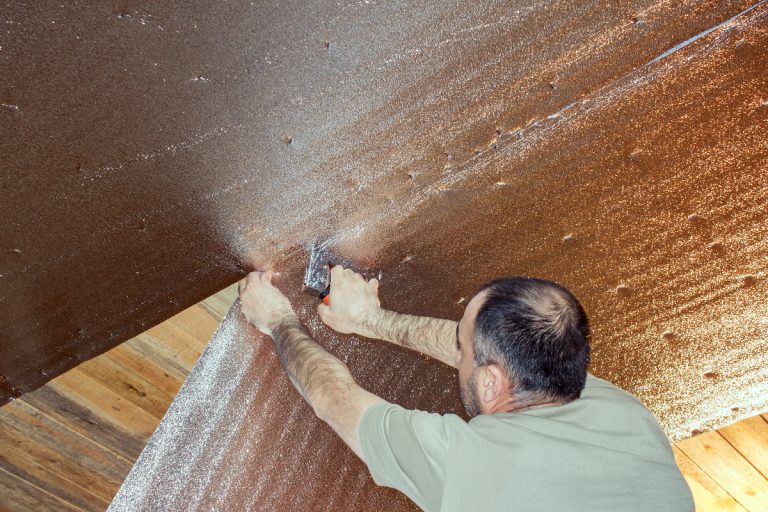 Builder attaches the insulation to the ceiling, How To Install Reflective Roll Insulation