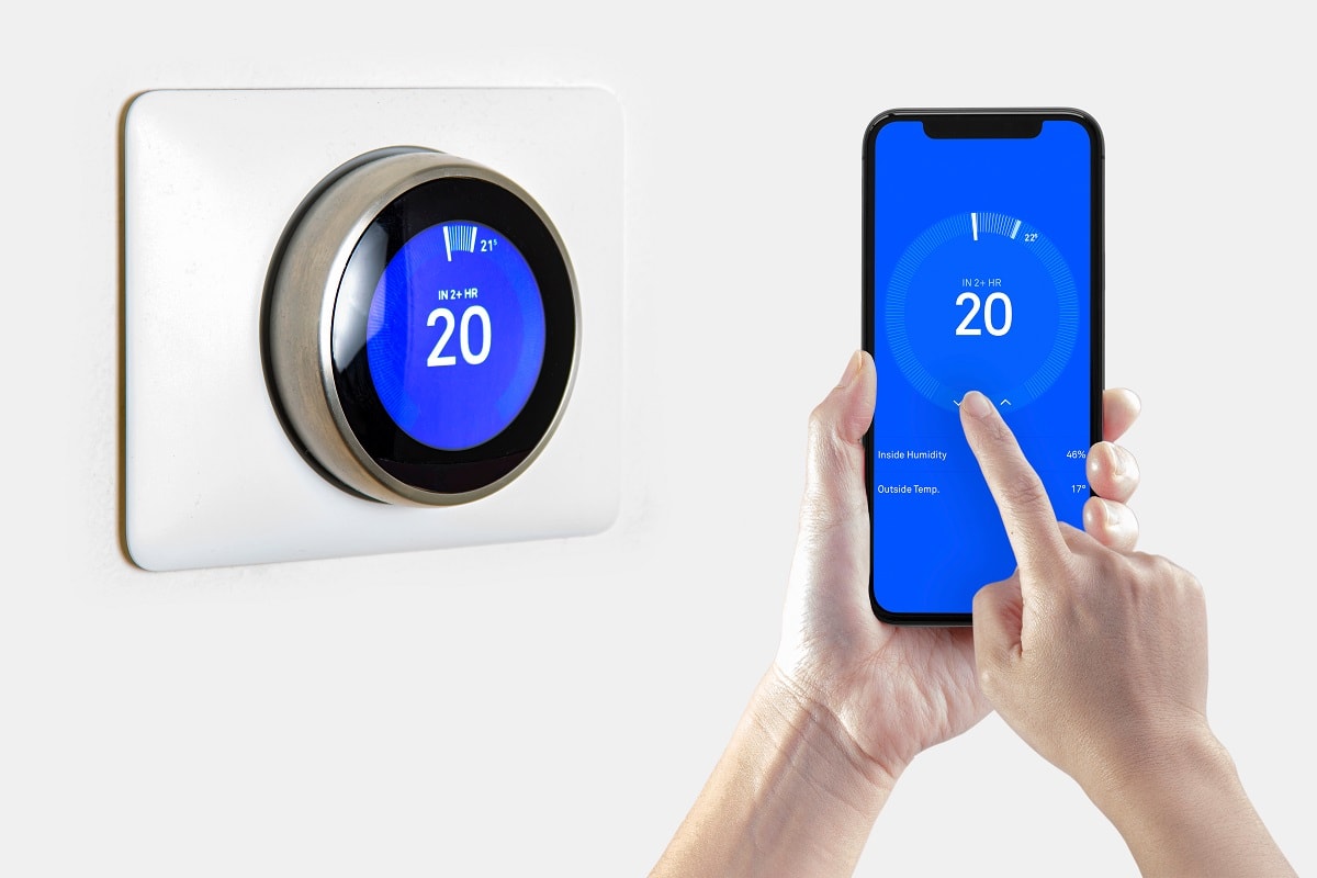 Customizable - A person cooling down with air conditioner with a iPhone 11 Pro Max using the nest app.