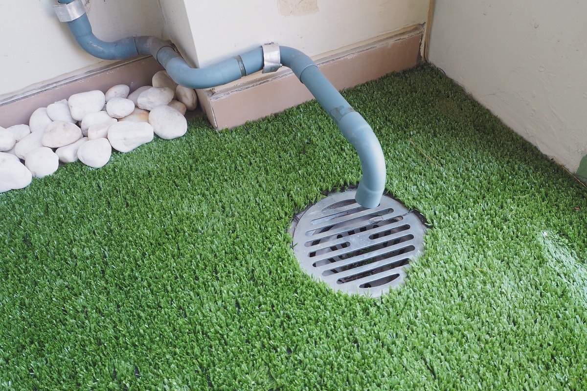 Dirty Drain Trap - Air conditioner sewer and fake grass floor at terraced house