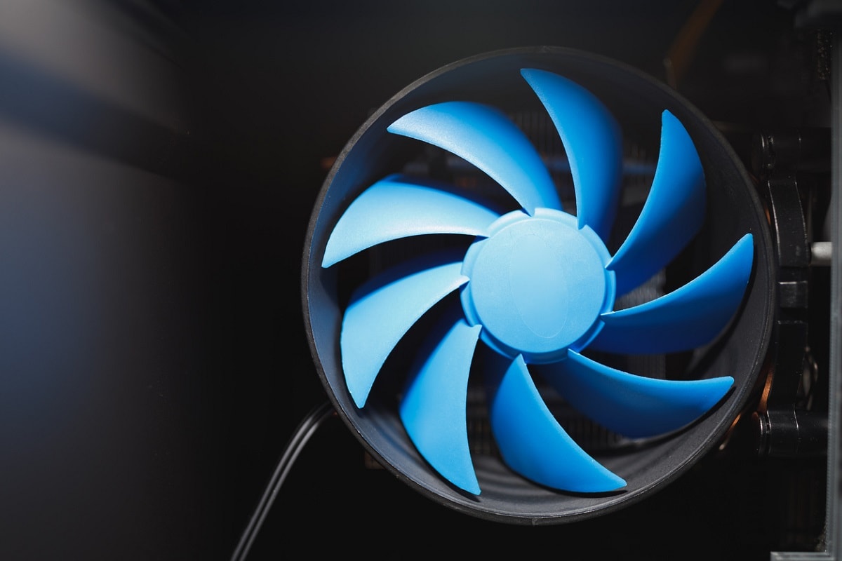 Due to cold weather, the fan was damaged. - blue cpu cooler inside PC case, close-up view