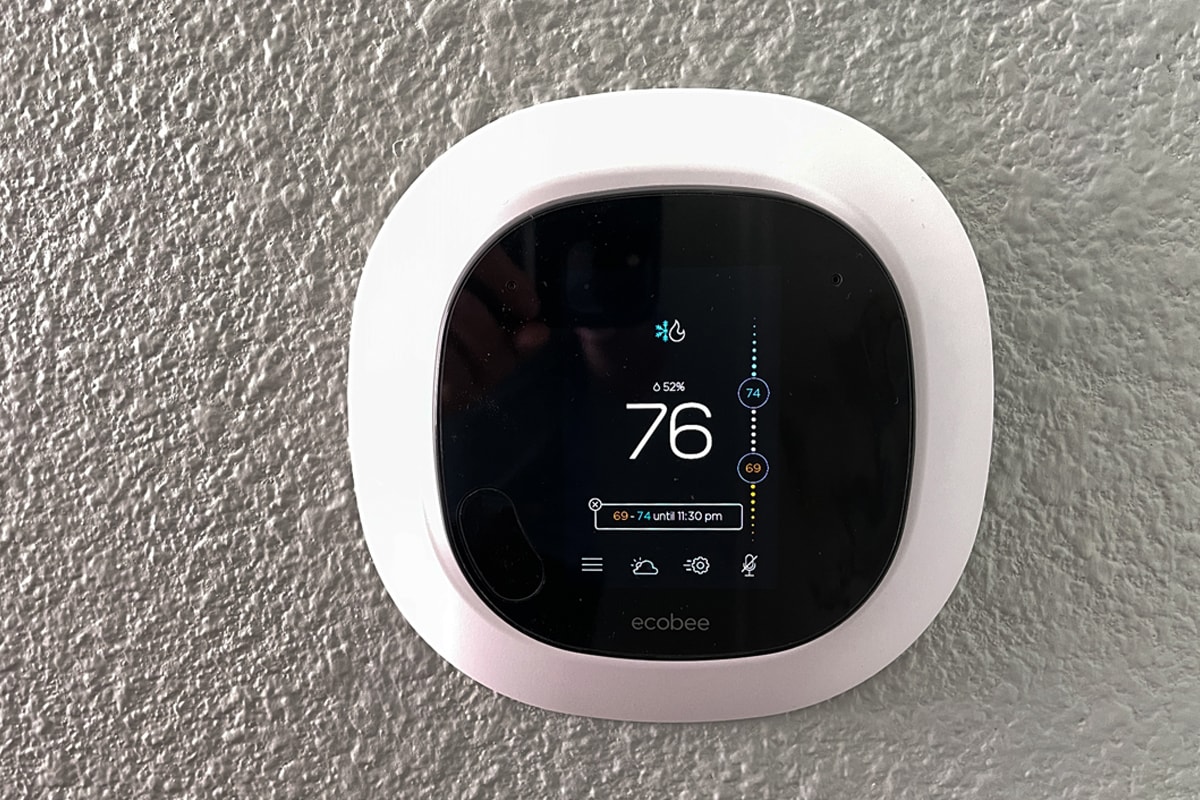 Ecobee smart thermostat attached on the wall