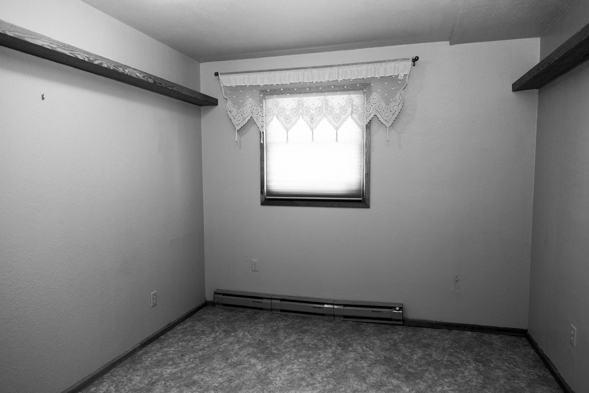 Empty unfurnished bedroom in an old house undergoing a home renovation project