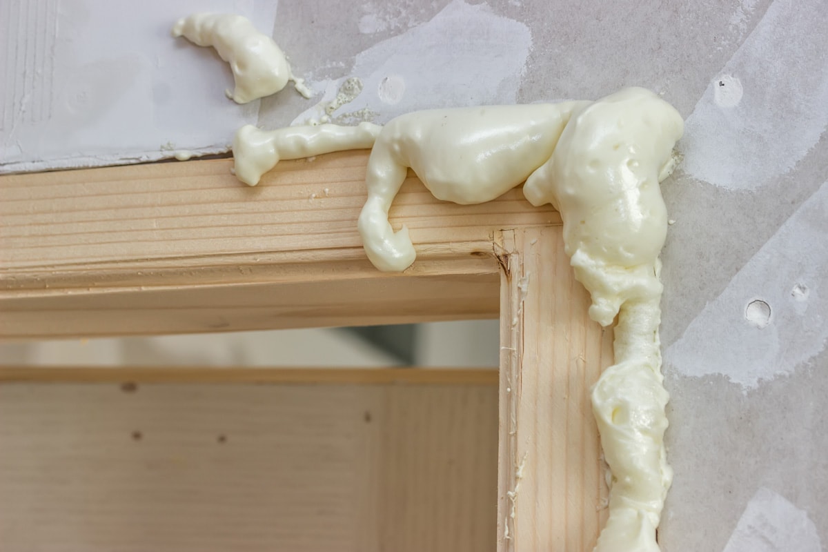 Expanding foam applied on the gaps of the door frame