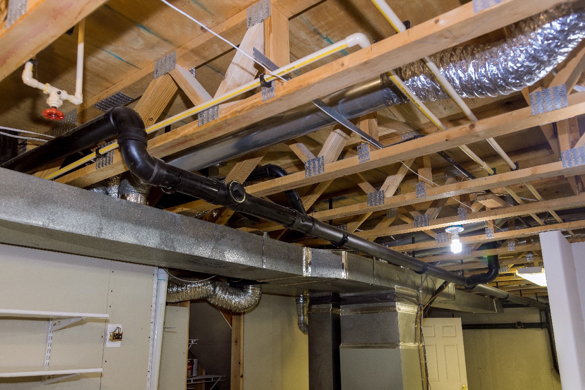 Framed home installation of air conditioner and heating ductwork in ceiling