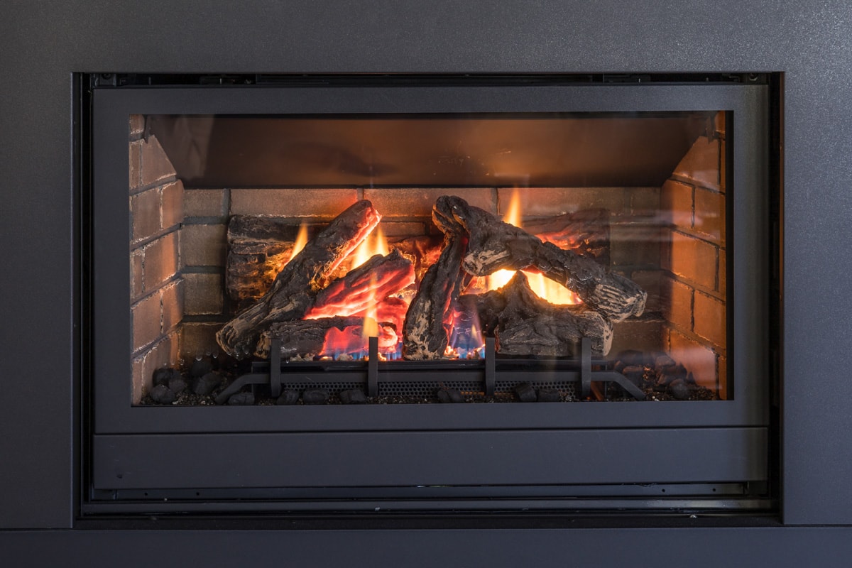 Gas Fireplace, Logs and Flames in Black Metal Frame