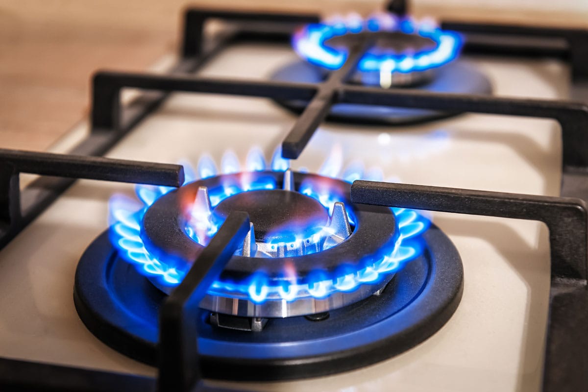 Gas cooker with burning flames of propane gas