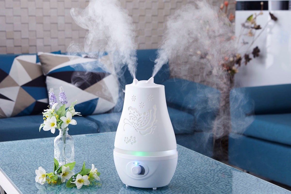 How Humidifiers Help Keep Moisture In The Air - Humidifier on the table，Fashionable home space