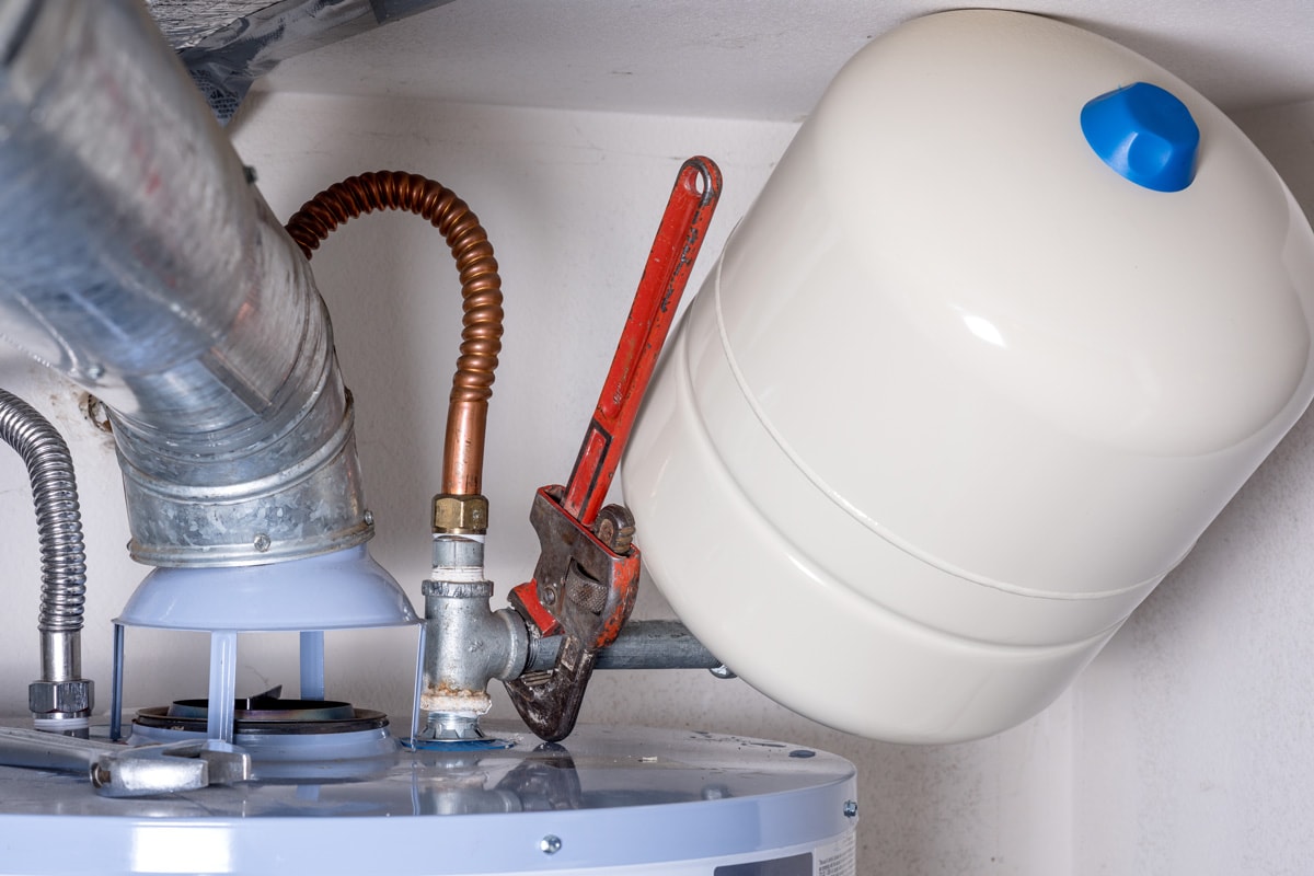 Installing boiler on top of a water heater system