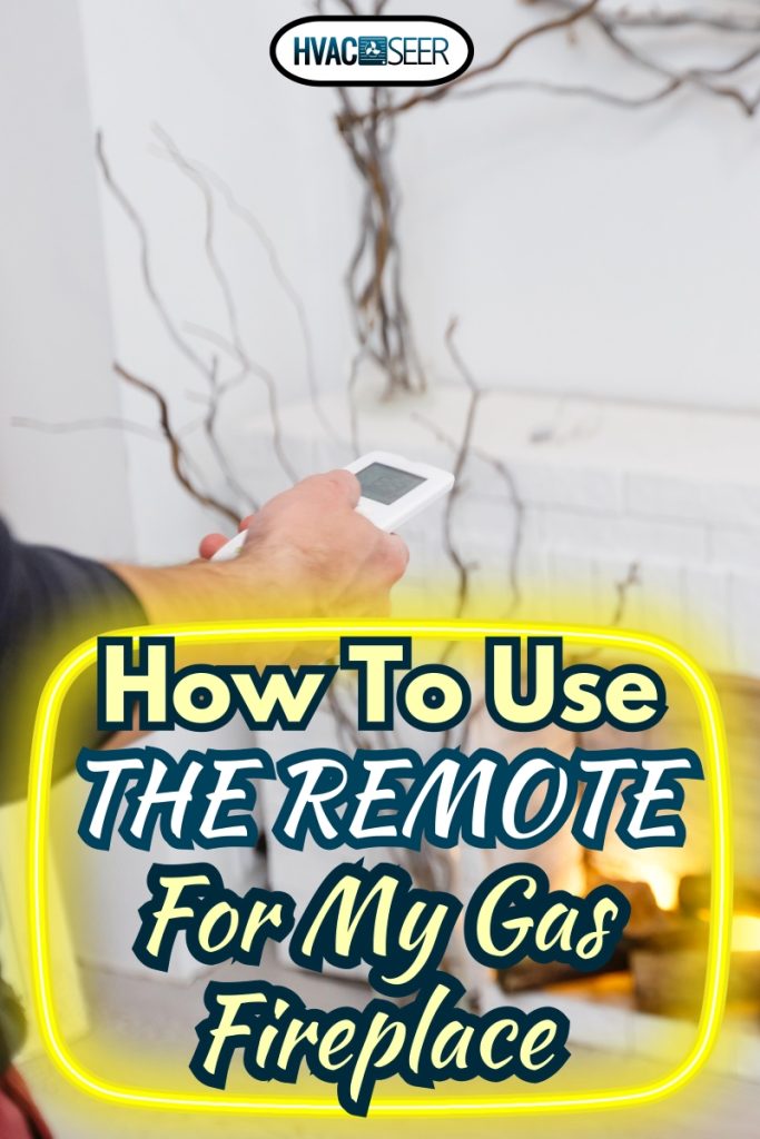 Man adjusting gas fireplace using remote control, How To Use The Remote For My Gas Fireplace