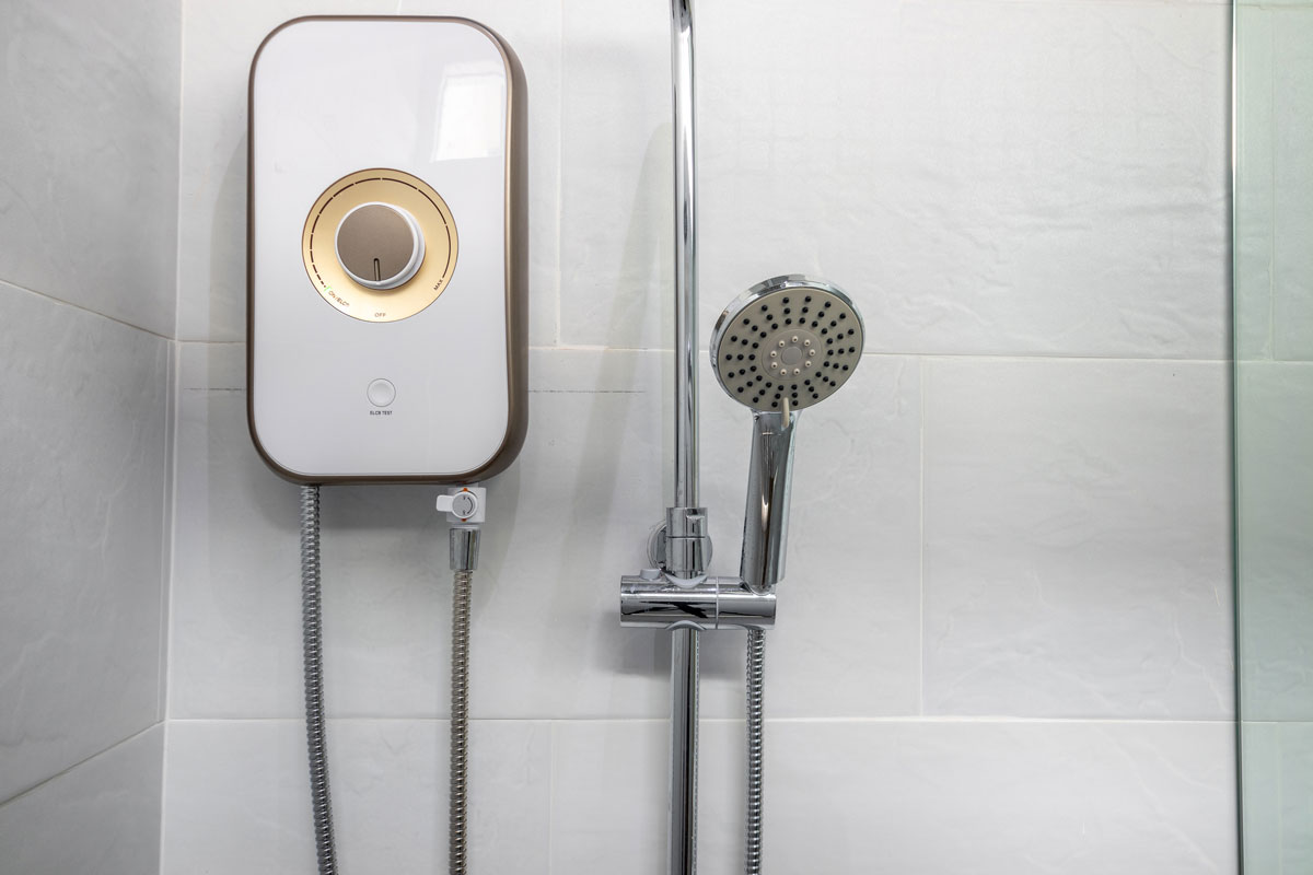 Shower and water heater in a white bathroom