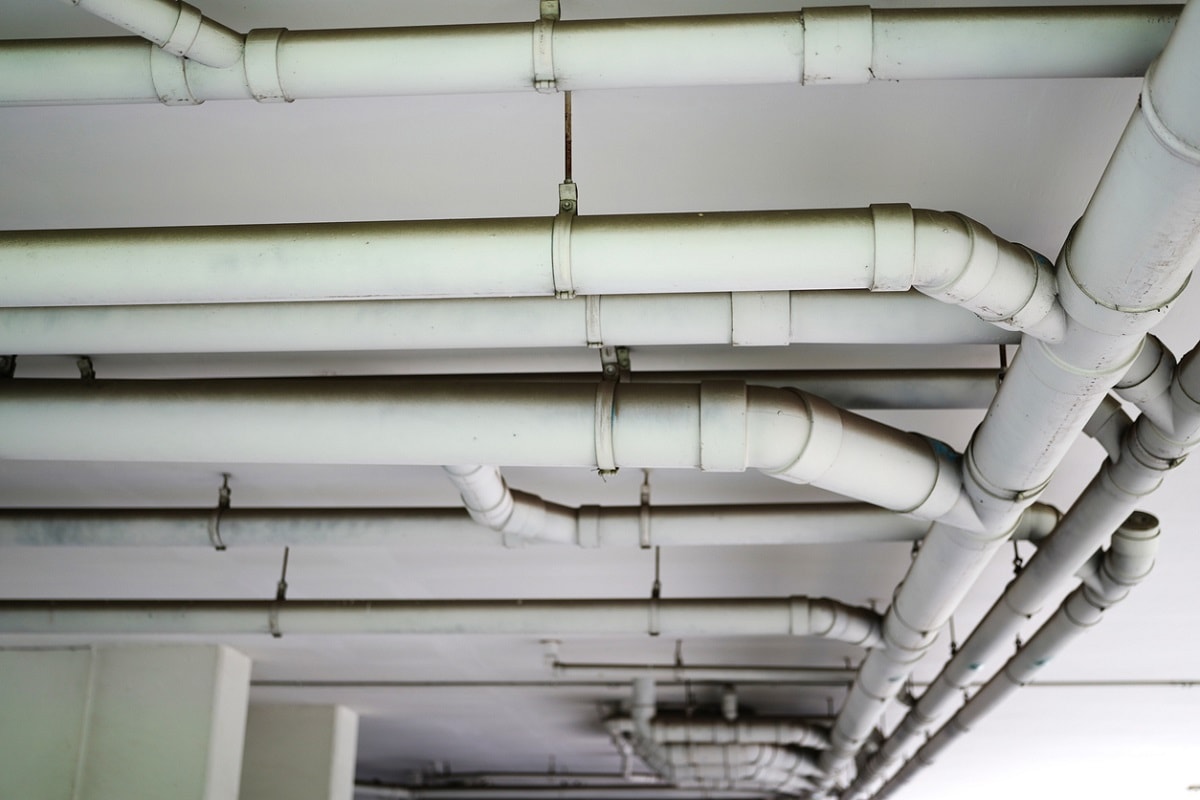 What Are Pipe Hangers - Sanitary system pipeline in construction site building under condo building site