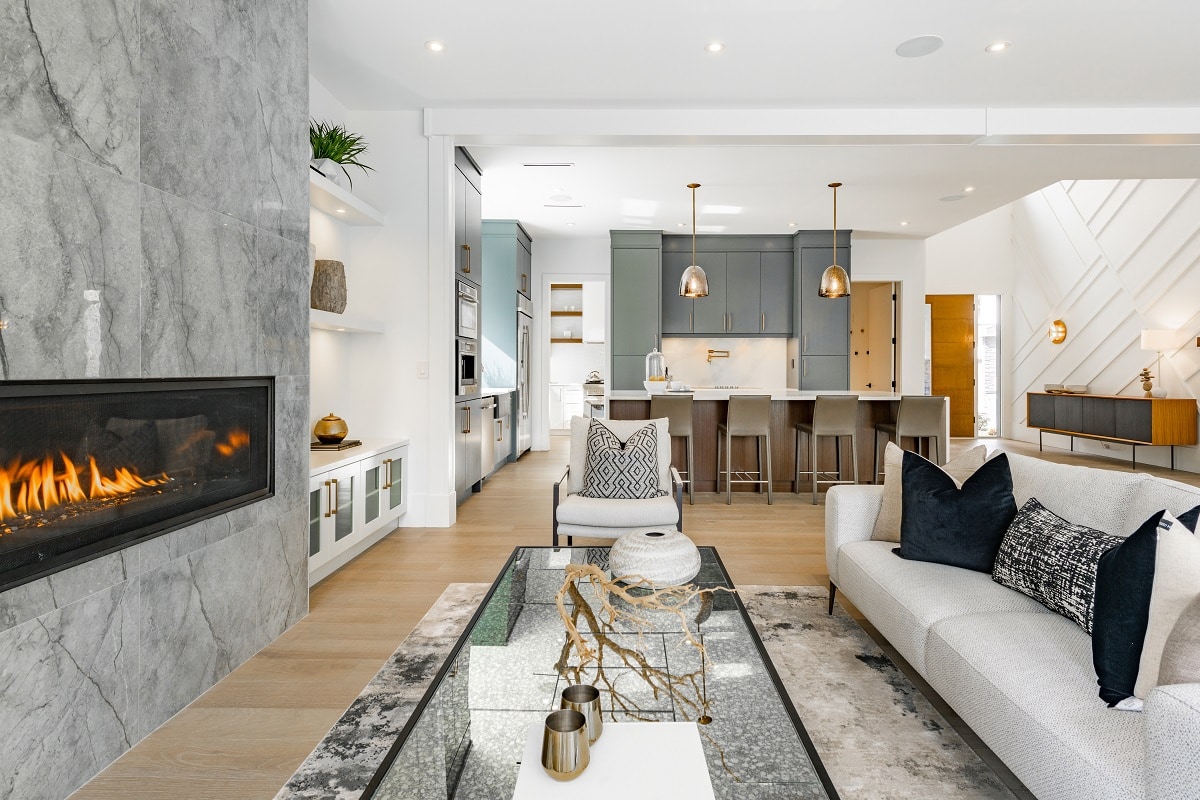 Why Won't The Gas Fireplace Stay Lit - contemporary living room with open concept view through to dining room kitchen and a marble fireplace with gas fire