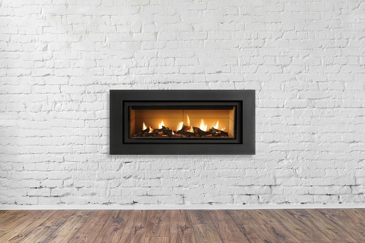 Wrapping Up - Gas Fireplace on white brick wall in bright empty living room interior of house.