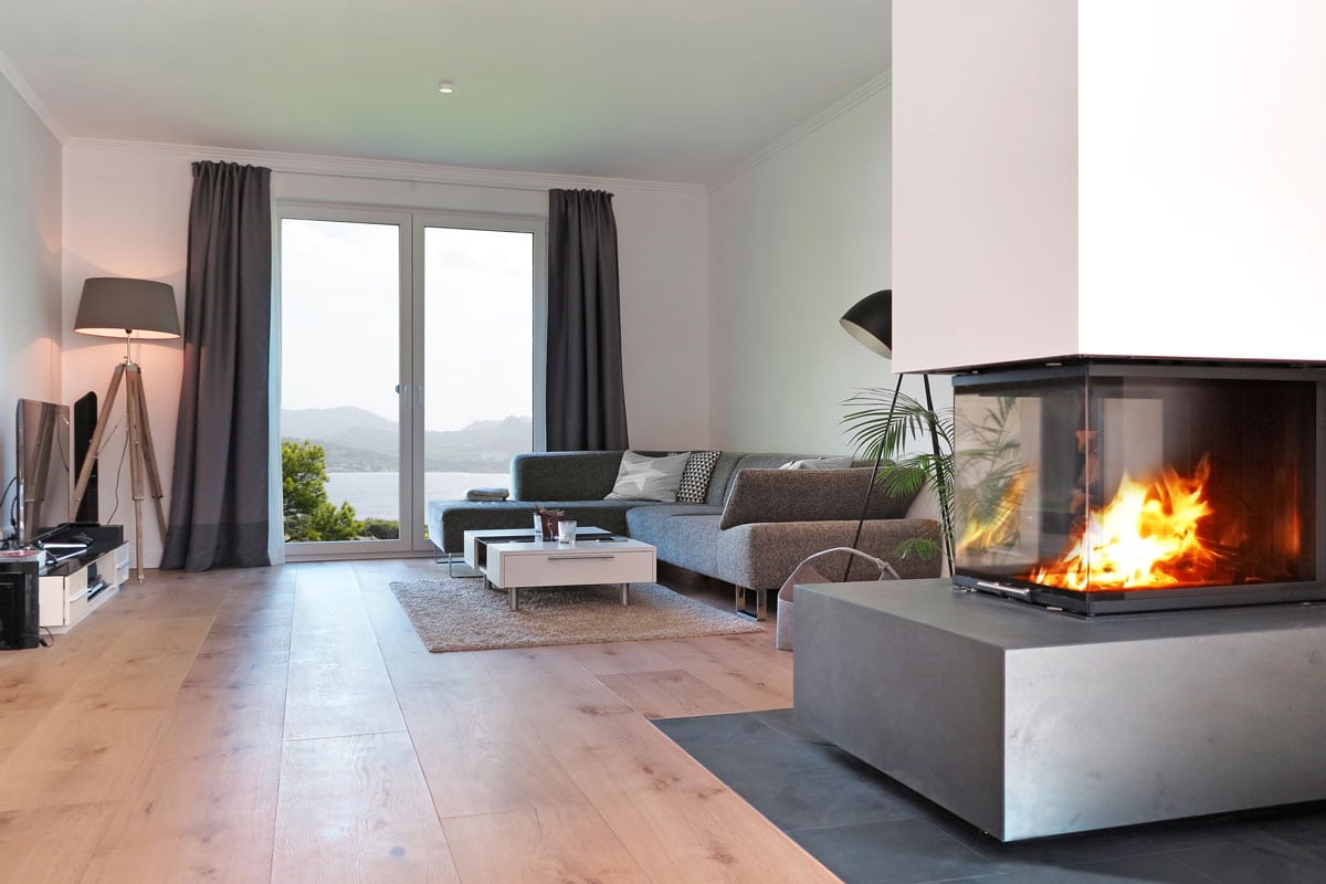 modern living room with fireplace and a view to the coast