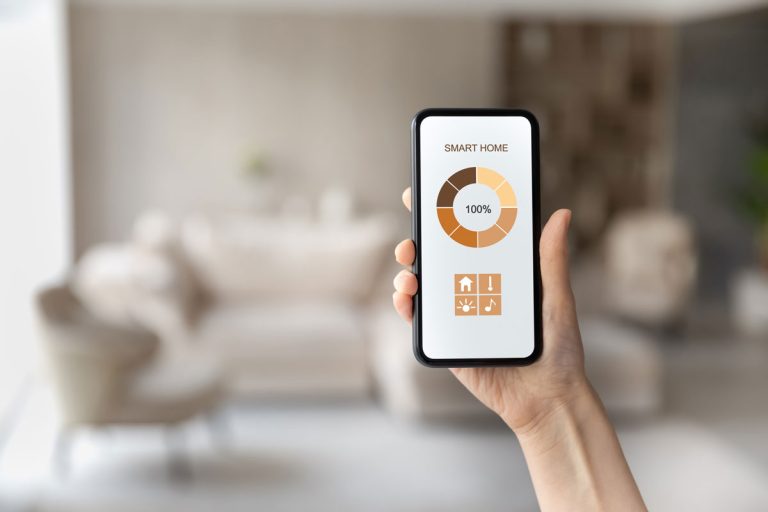 photo of a woman hand holding a smart phone showing smart app for the smart home, My Bosch Thermostat Won't Connect To Wifi - What To Do?