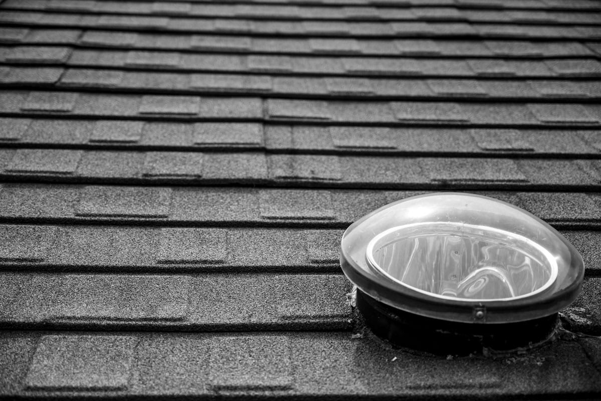 photo of a dome-shaped-solar-tube-skylight-on the roof of the house