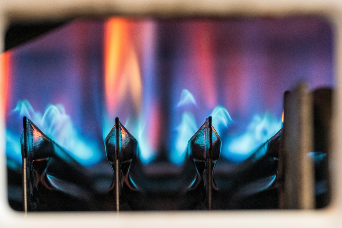 A gas propane furnace burner photographed up close