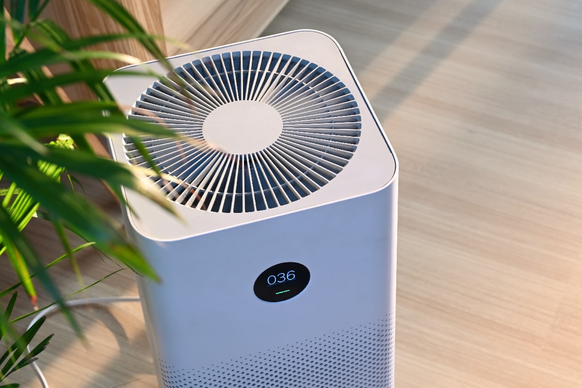 Air purifier on wooden floor in comfortable home