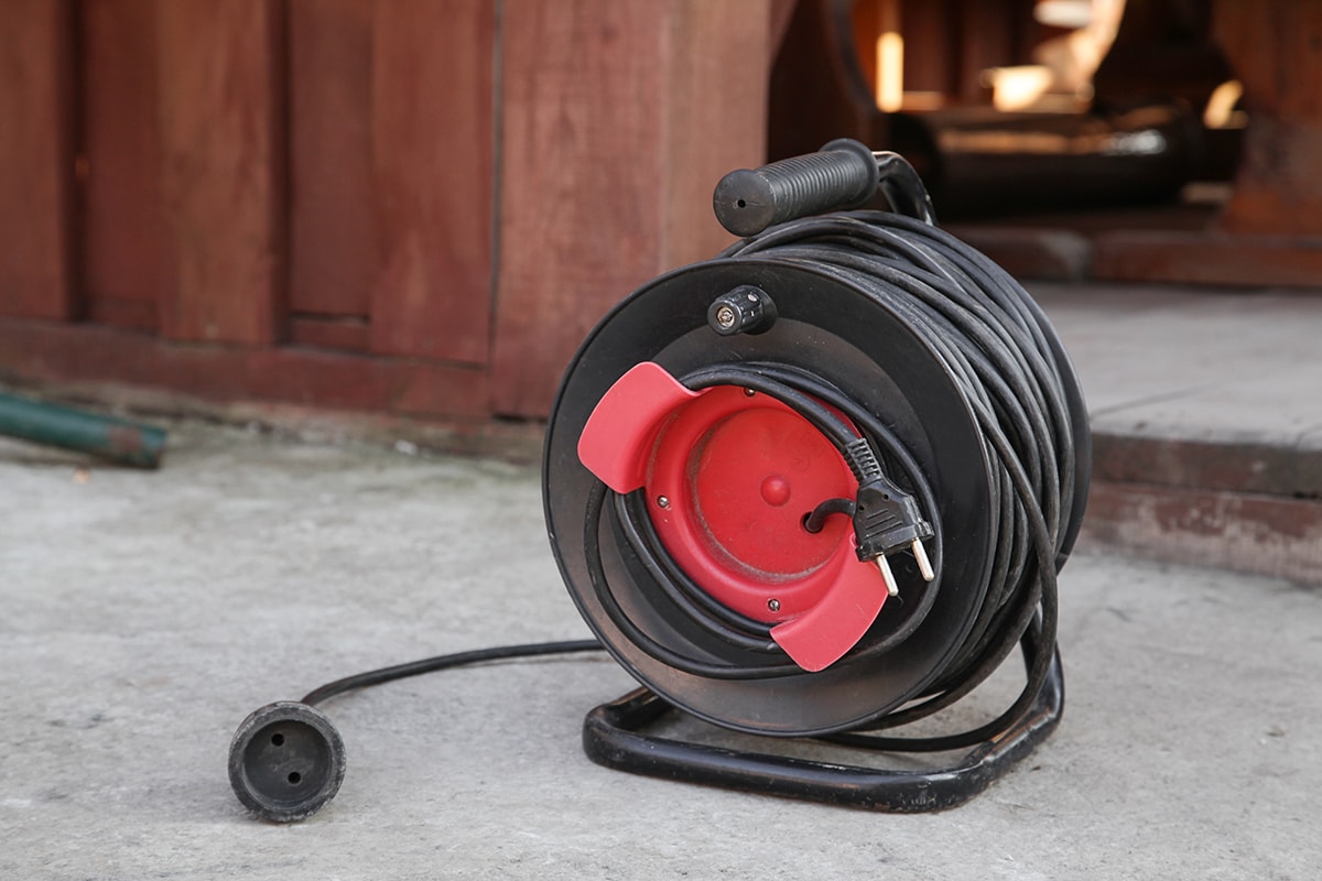 Electrical Long Extension cable cord on reel with remote socket outdoor