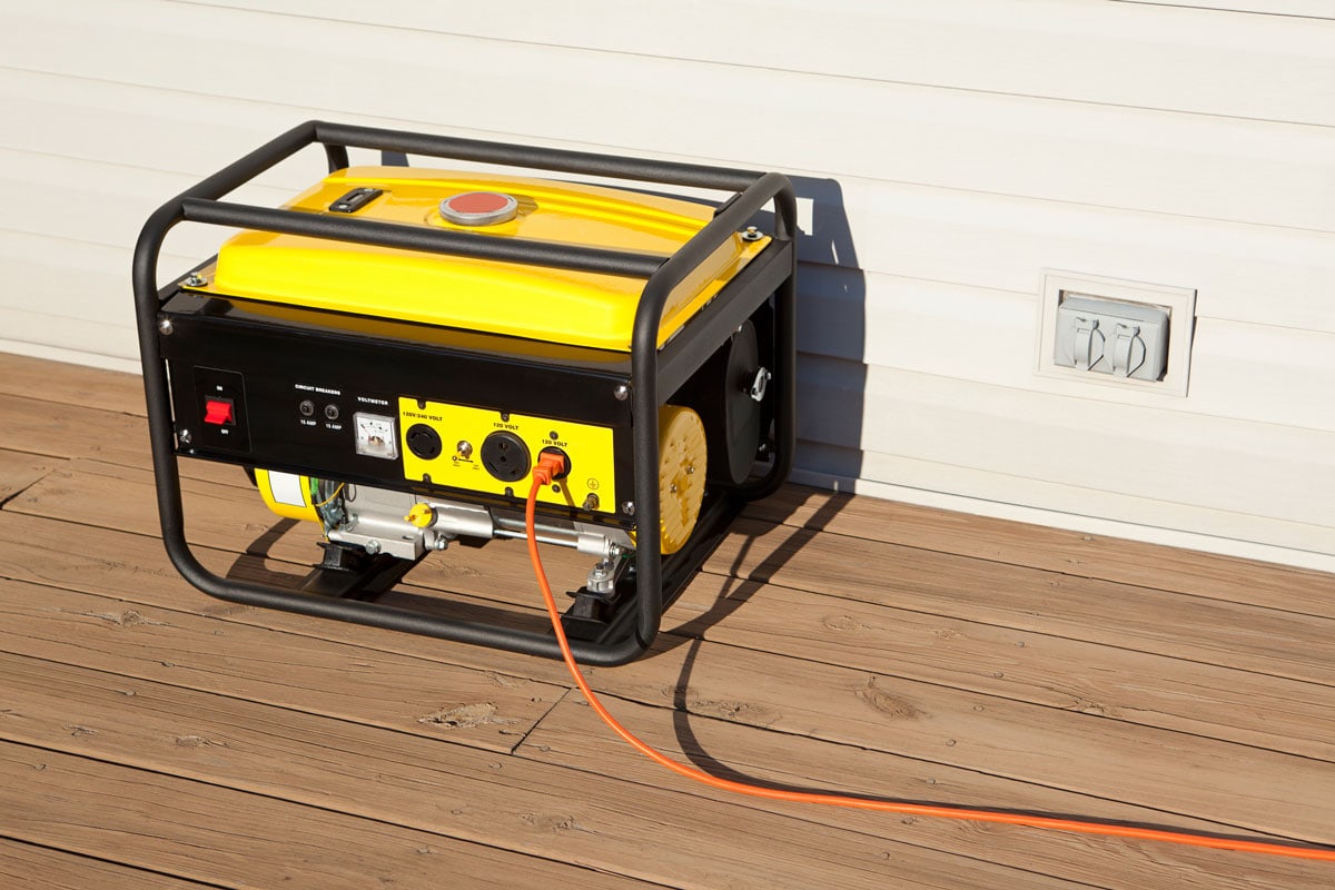 Extension cord plugged into a gasoline powered, 4000 watt, portable electric generator