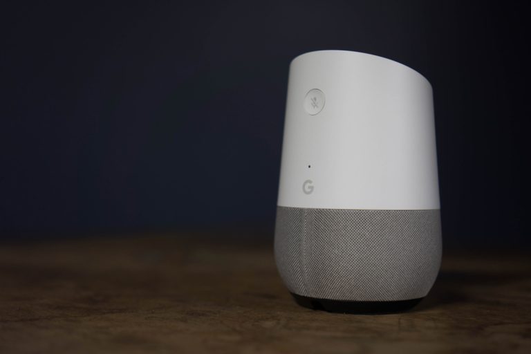Google home Packshot on wood desk, the voice recognition streaming device utilizing Google Assistant from Google on Dec 30 2017 in Maryland, United States , Does Google Home Have A Temperature Sensor?
