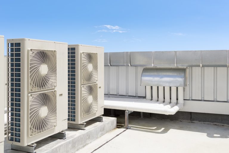 Air compressor or air condenser unit located on roof deck building to heat released transferred to surrounding environment, Compressor is part of cooling function and air conditioning HVAC systems., Does Central Air Use More Electricity Than Window Units?