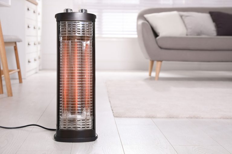 Modern electric heater on floor at home, What Does E1 Mean On A Infrared Heater? [& How To Fix It]