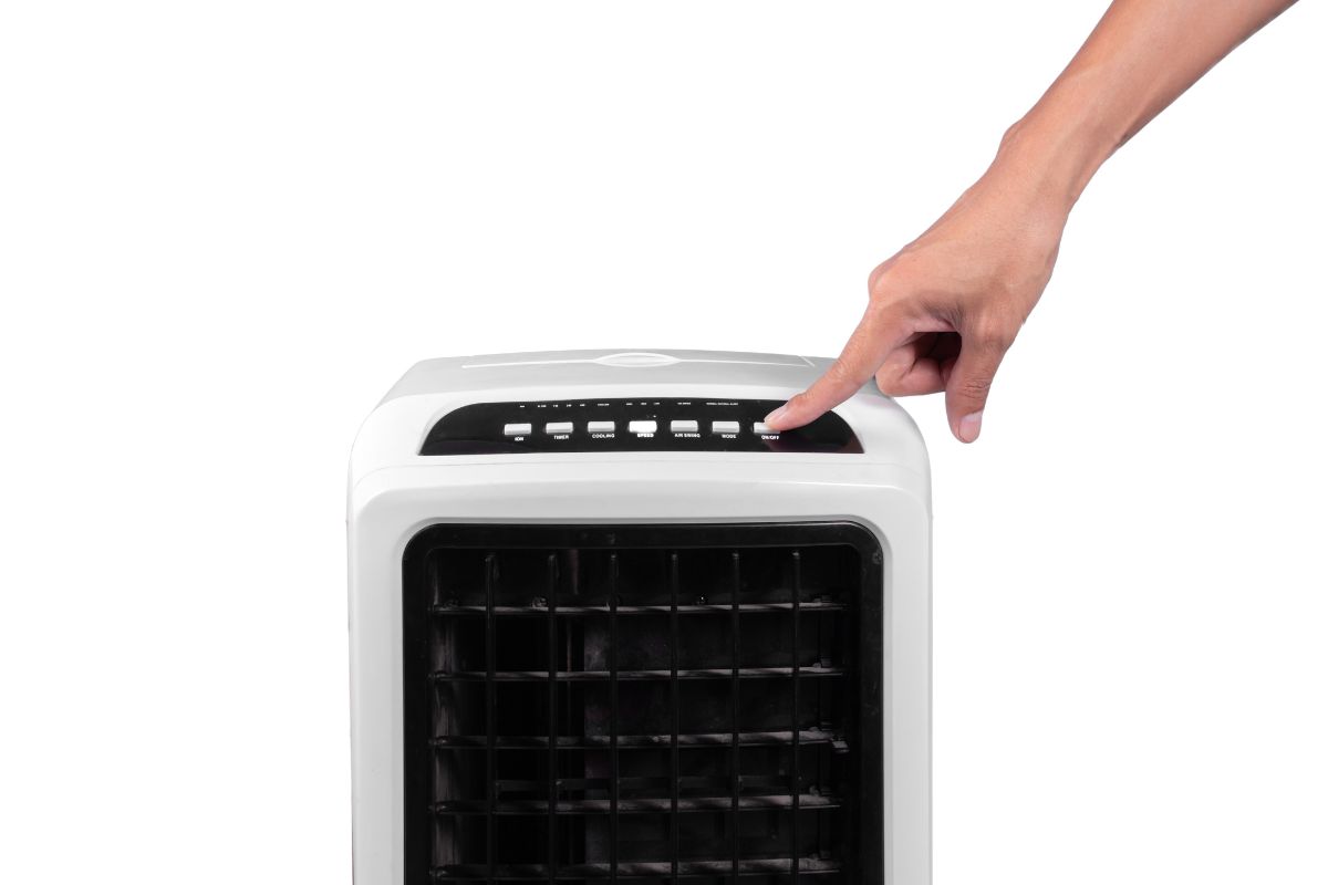 Portable evaporative air cooler with ionizer isolated on white background.