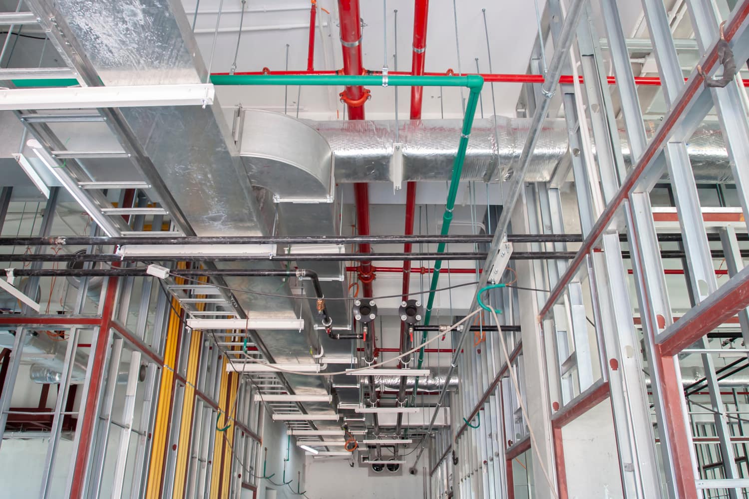 Typical installation of ducting with fiberglass insulation work combine with cable tray and fire fighting pipe