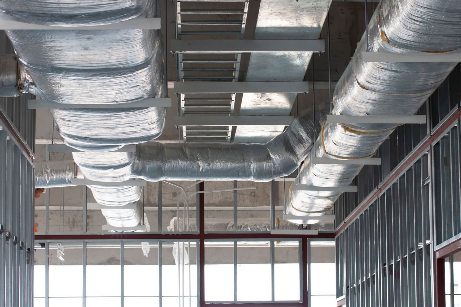 Typical installation of ducting with fiberglass insulation work combine with cable tray