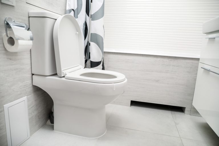 White toilet bowl in bathroom - Does Toilet Flange Go Inside Pipe Or Outside