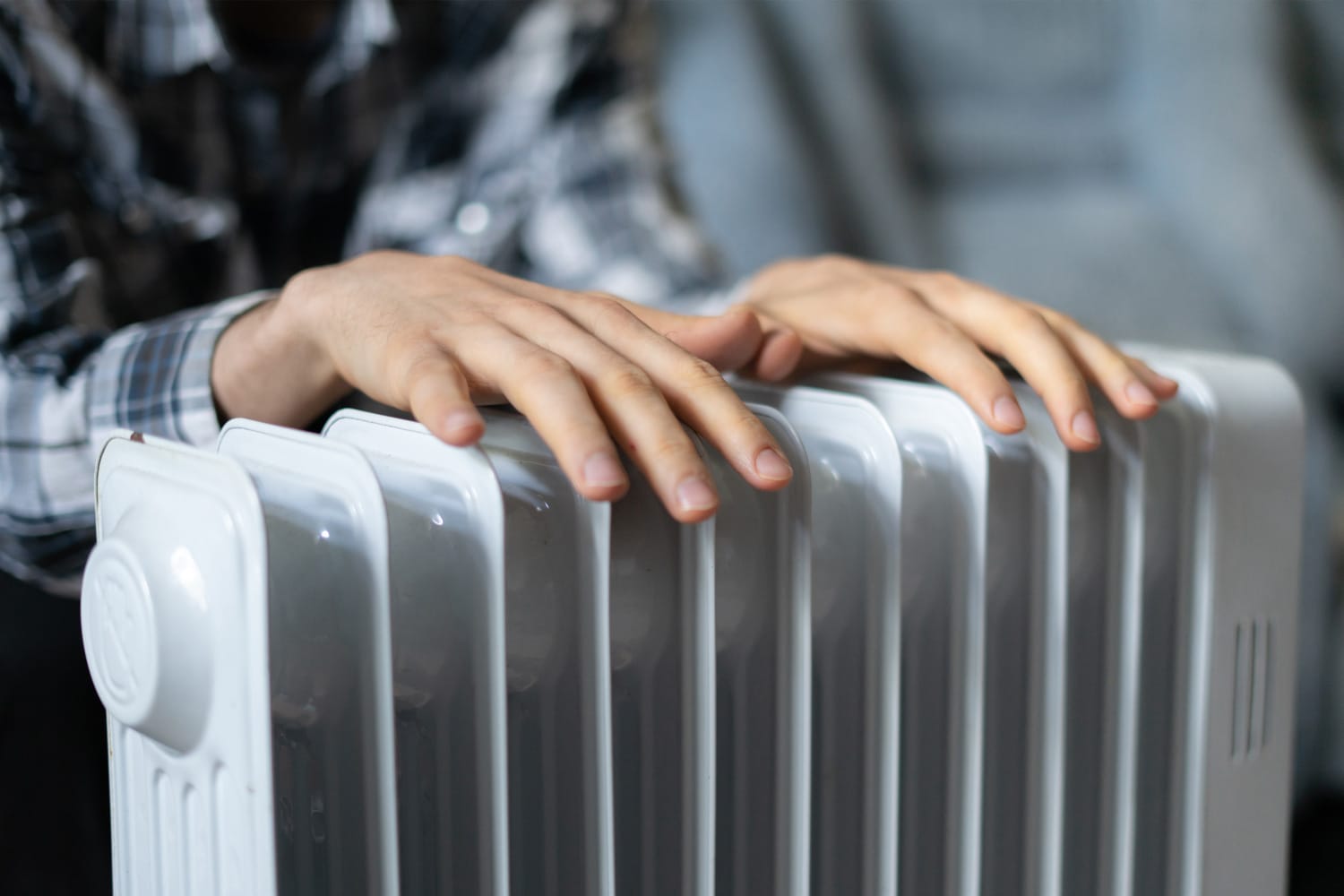 Feeling cold, getting warm, hands touching the heater