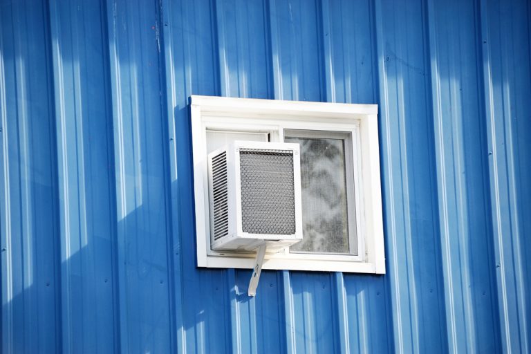 old air conditioner installed on house window, Where Is The Condensation Drain On A Window AC?