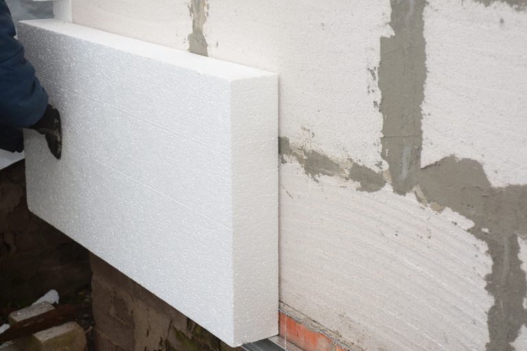 Builder installing rigid styrofoam insulation board for energy saving, How To Install Rigid Foam Insulation On Interior Walls