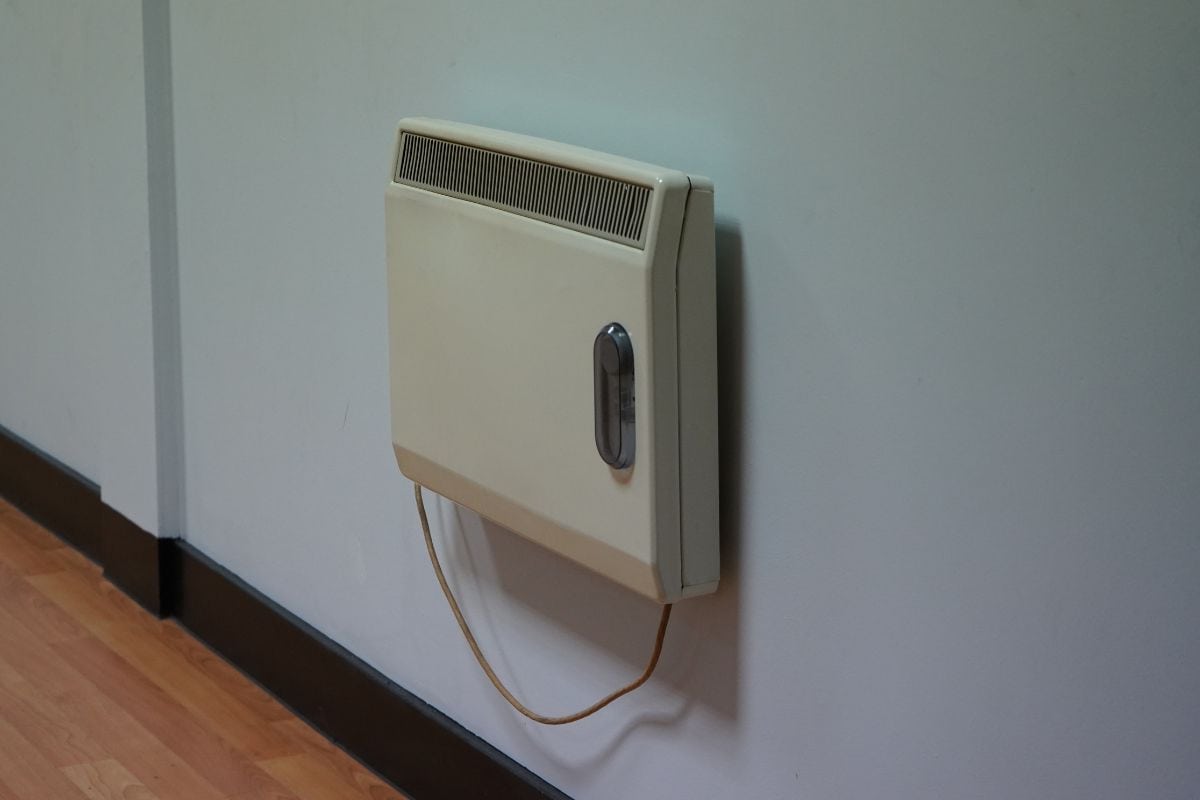 Heat-store heater mounted on a white wall