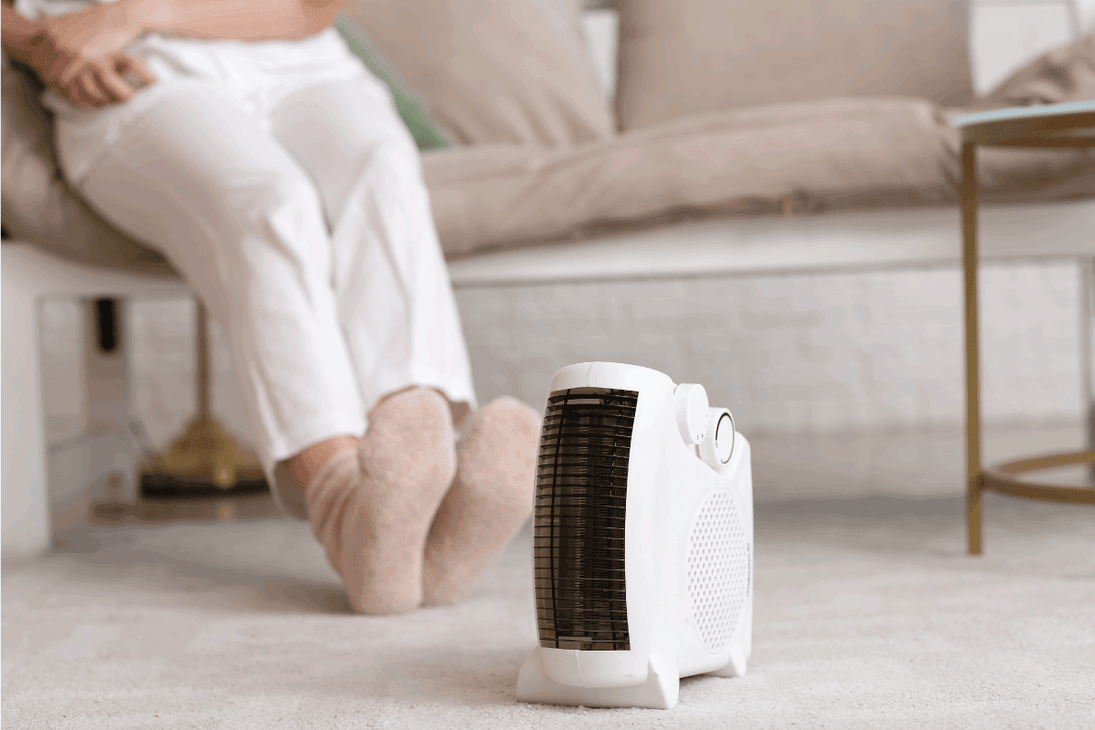 Modern electric fan heater on carpet in living room. How To Use A Heat Storm Heater
