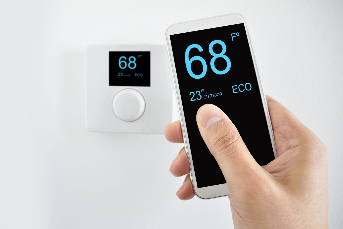 regulating the temperature from the smartphone and controlling the digital thermostat with finger pressing button