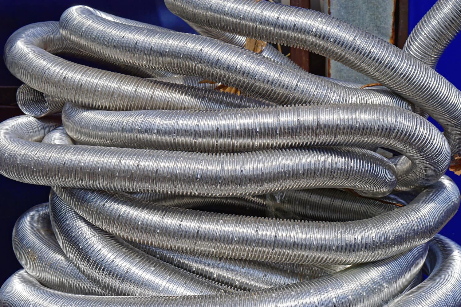 Big bunch of flexible aluminium hoses and pipes 