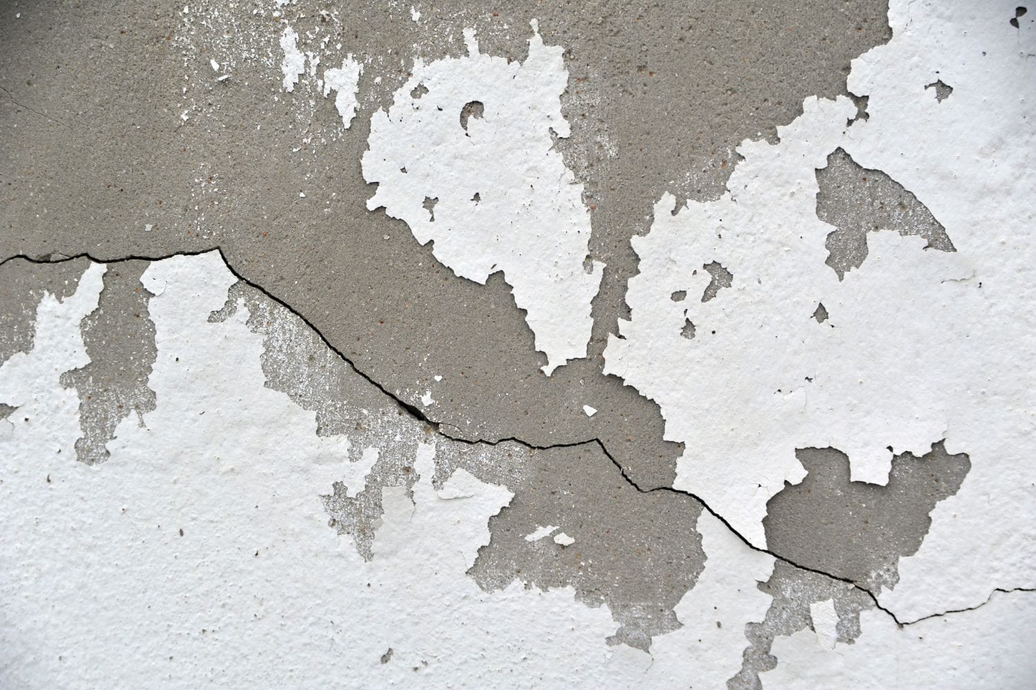 Concrete cracked wall as a grunge background