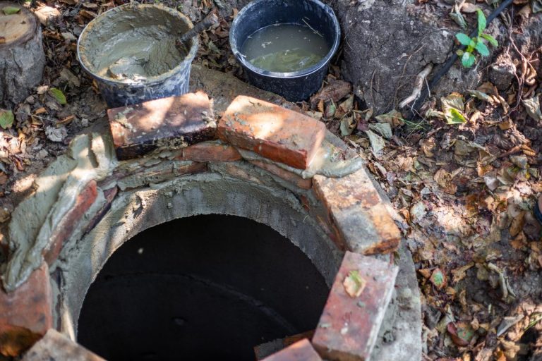 Laying out of bricks the mouth of a septic well. Work with cement, construction of a septic tank. - Cesspool Maintenance Problems: Considerations For Home Buyers!