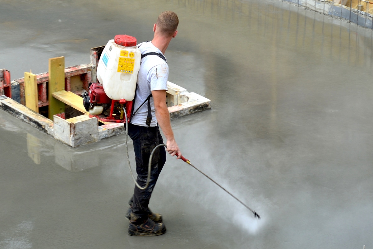 Spray radonseal sealer on the floor basement
