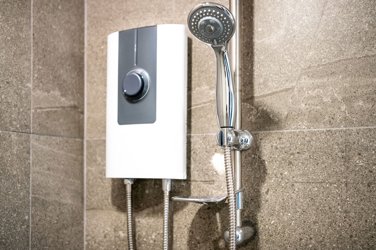 A modern sleek design tankless water heater photogrpahed in the bathroom